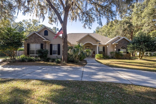 ranch-style house with a front lawn