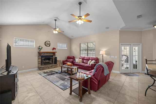 tiled living room with ceiling fan, ornamental molding, a fireplace, and high vaulted ceiling