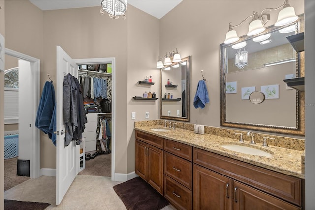 bathroom featuring tile patterned flooring and vanity