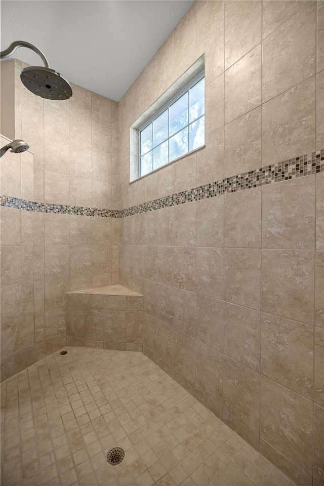 bathroom with a tile shower