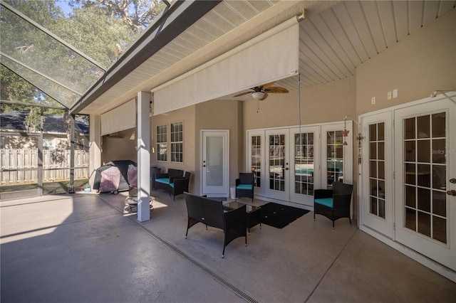 view of patio / terrace with french doors, an outdoor hangout area, ceiling fan, and a lanai