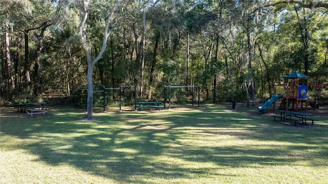 surrounding community featuring a yard and a playground