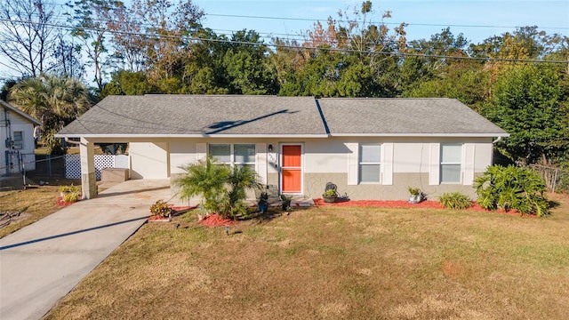 single story home with a carport and a front yard