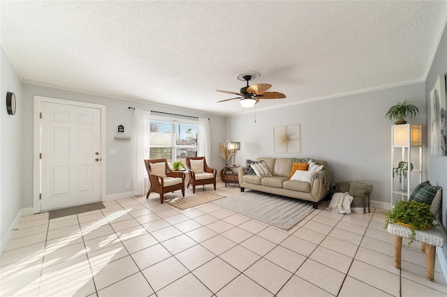 tiled living room with ceiling fan, ornamental molding, and a textured ceiling