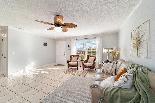 living room featuring light tile patterned floors, a textured ceiling, and ornamental molding