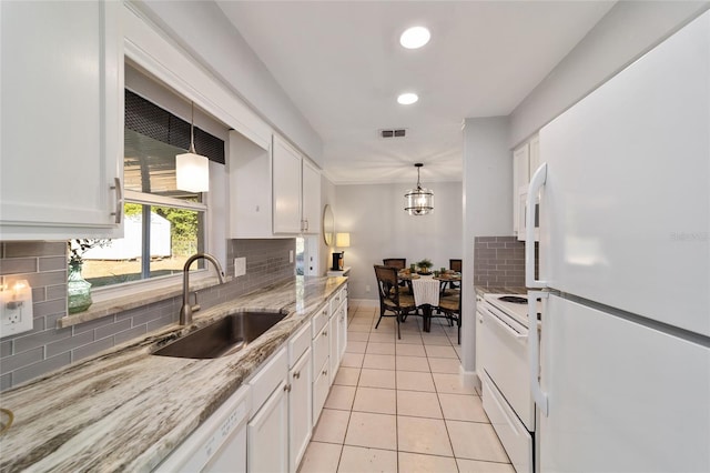 kitchen featuring white cabinets, white appliances, backsplash, and sink