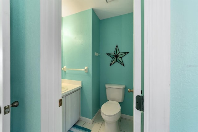 bathroom with tile patterned floors, vanity, and toilet