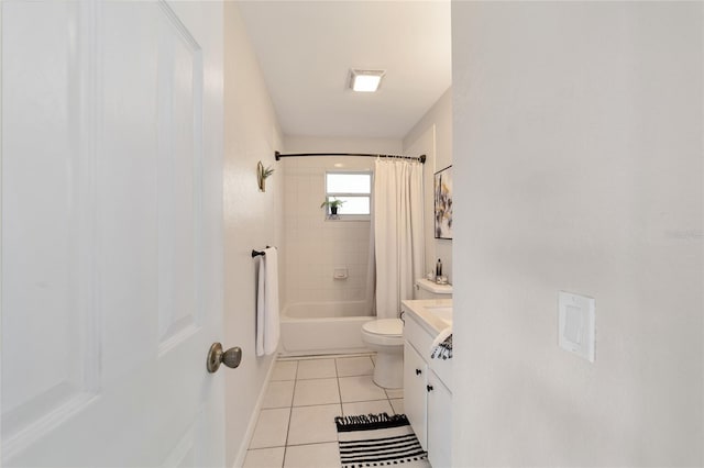 full bathroom with toilet, tile patterned flooring, vanity, and shower / tub combo with curtain