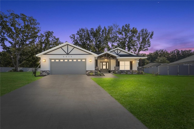 view of front facade featuring a yard and a garage