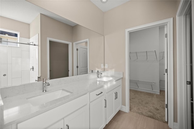 bathroom with tile patterned flooring and vanity