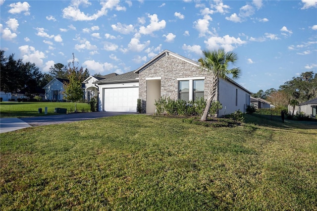 ranch-style home featuring a front yard and a garage