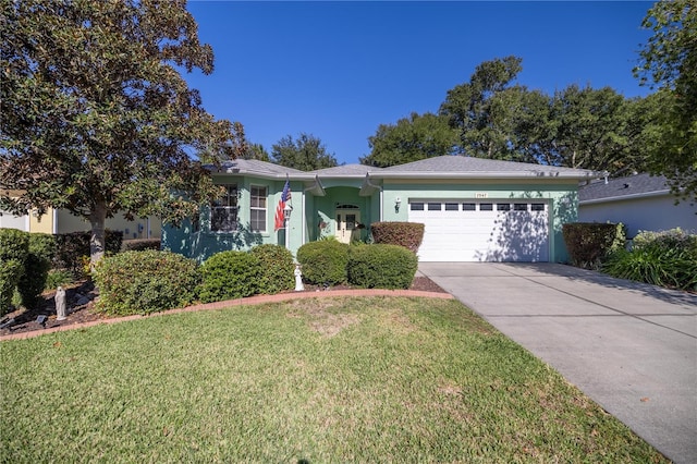 ranch-style house with a front yard and a garage