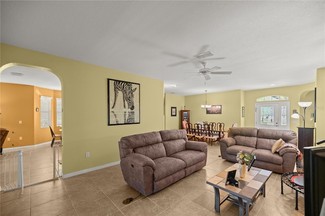 living room featuring ceiling fan and light tile patterned flooring