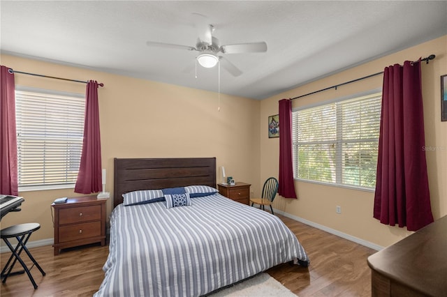 bedroom featuring light hardwood / wood-style floors and ceiling fan