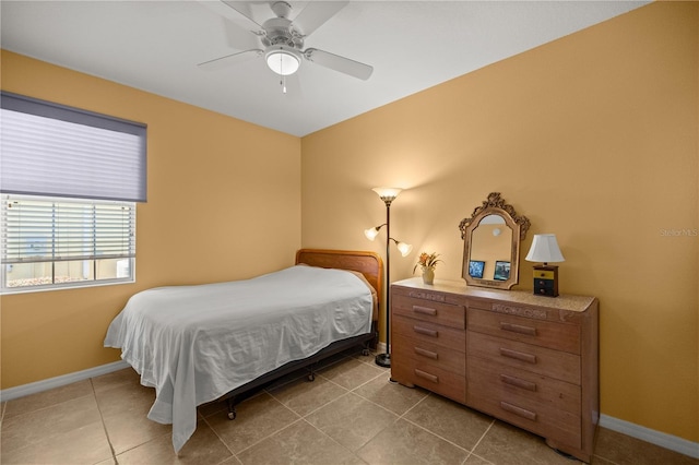 bedroom with light tile patterned floors and ceiling fan