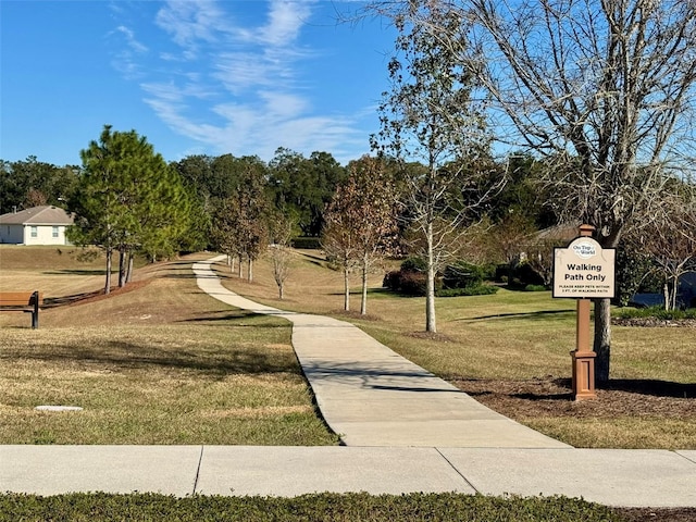 view of home's community featuring a yard