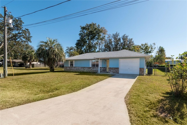 single story home featuring a front lawn and a garage