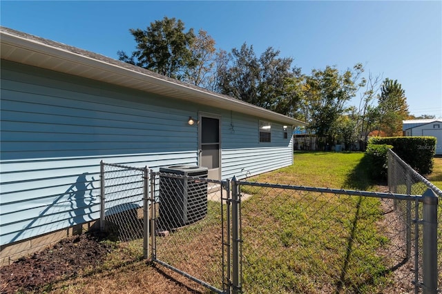 exterior space with a yard and central air condition unit