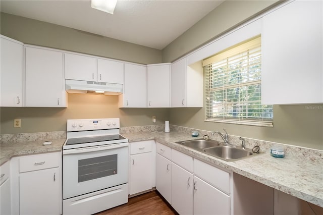 kitchen with electric stove, sink, white cabinets, and dark hardwood / wood-style floors