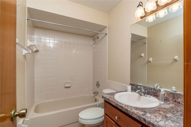 full bathroom featuring vanity, toilet, and tiled shower / bath combo