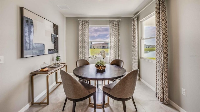 dining space featuring light tile patterned floors