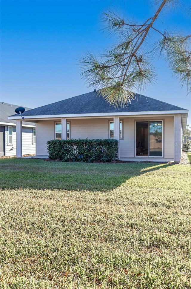 ranch-style house featuring a front lawn