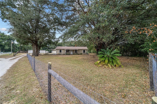 ranch-style home featuring a front yard