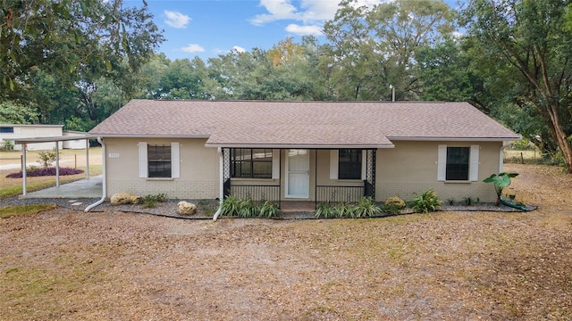 ranch-style home featuring a porch