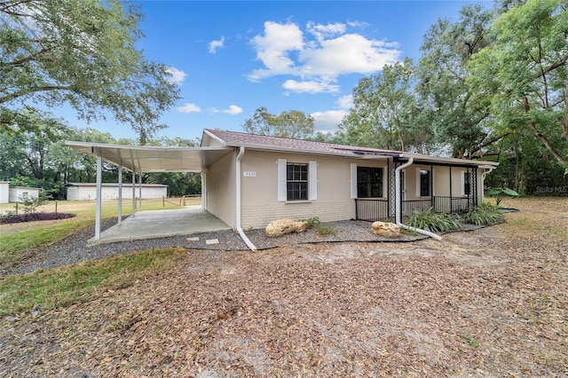 view of front facade with a carport