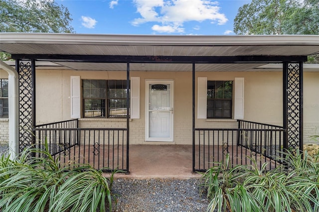 entrance to property with covered porch