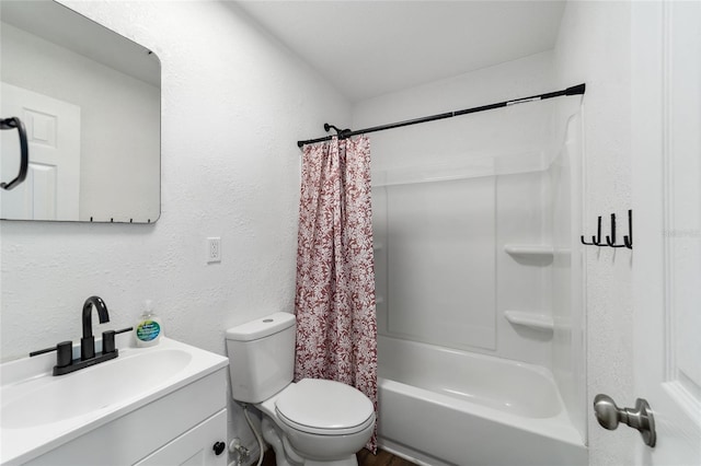 full bathroom featuring shower / tub combo with curtain, vanity, and toilet