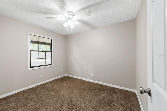 spare room with carpet flooring, a textured ceiling, and ceiling fan