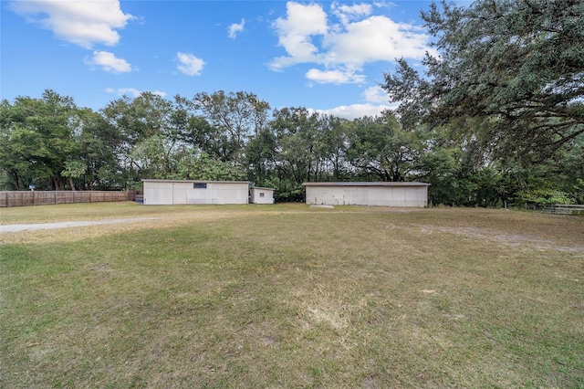 view of yard with an outdoor structure