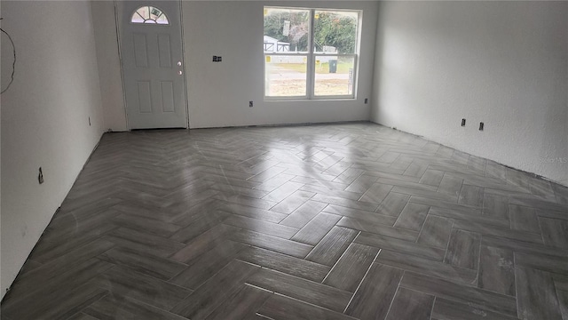 interior space with dark parquet floors