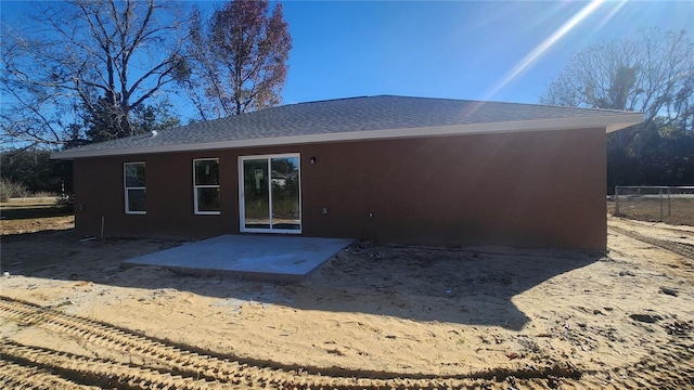 rear view of house featuring a patio