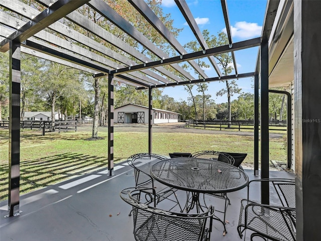 view of patio / terrace featuring fence, outdoor dining space, and a pergola