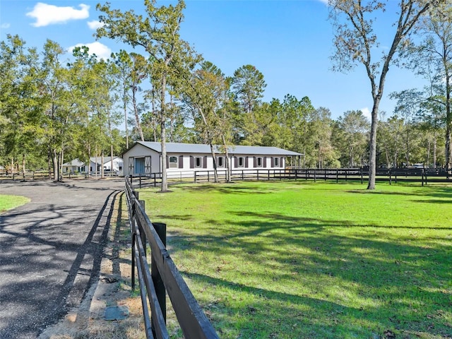 exterior space with a lawn and fence