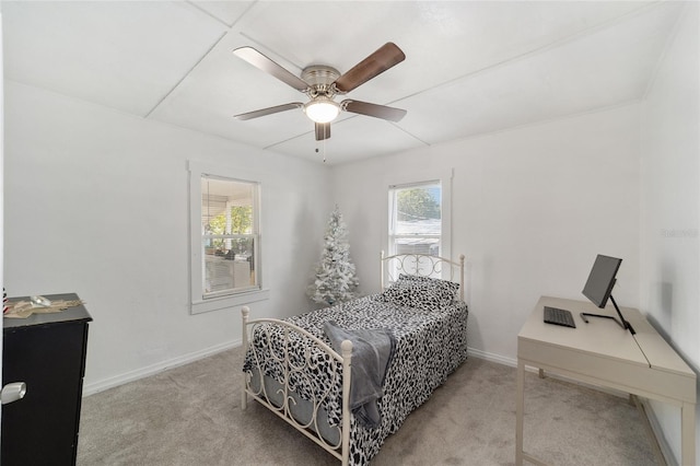 bedroom with light colored carpet and ceiling fan