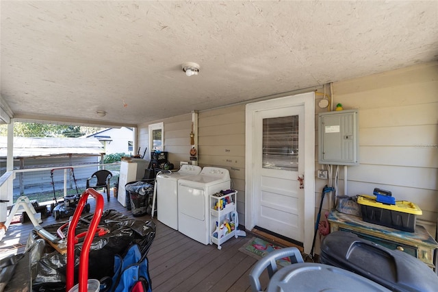 wooden terrace featuring washer and dryer and electric panel