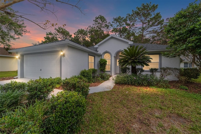 single story home with a garage