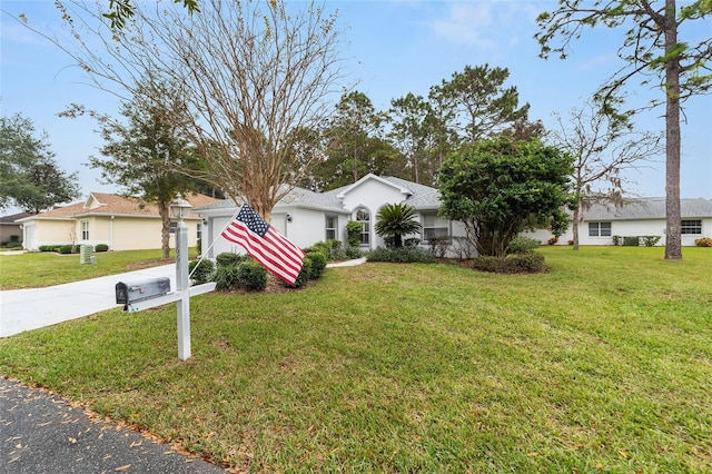 ranch-style house with a front yard