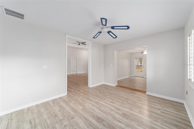 empty room featuring ceiling fan and light wood-type flooring