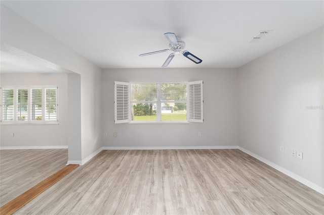 spare room with ceiling fan and light hardwood / wood-style floors