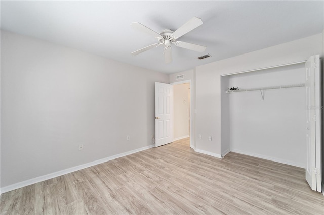 unfurnished bedroom with ceiling fan, a closet, and light hardwood / wood-style flooring