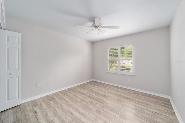 spare room featuring ceiling fan and light wood-type flooring