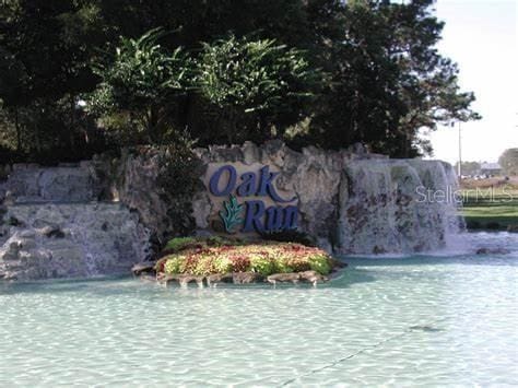 view of swimming pool with a water view