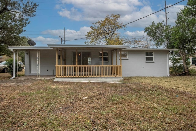 view of front of house with covered porch and a front yard