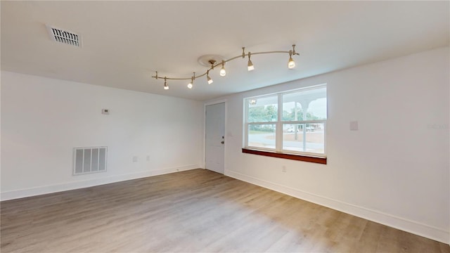 unfurnished room featuring wood-type flooring