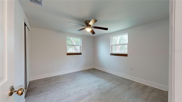 unfurnished bedroom with ceiling fan and light hardwood / wood-style flooring