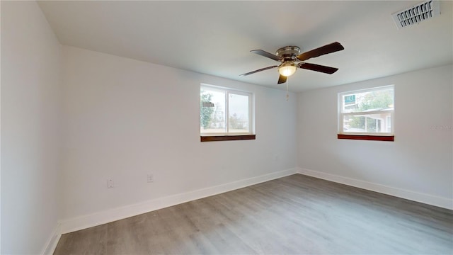 spare room featuring ceiling fan and hardwood / wood-style flooring